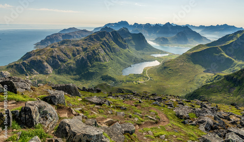 19 july 2025, Napp, Norway. View from Stornappstinden mountain peak towards ocean, see. Amazing landscape with mountains and fjords during summer. Outdoor hiking travel destination. Beautiful nature.