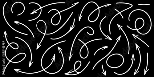 Chaotic arrangement of white arrows on a black background