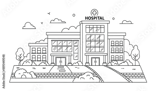 A large hospital building with a sign on top and trees and bushes in front