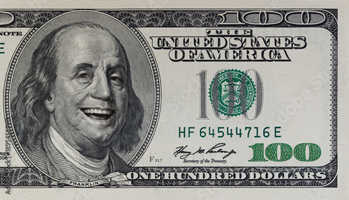 Benjamin Franklin smiling on 100 dollar banknote
