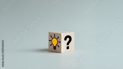 Wooden block with question mark and light bulb icon. for FAQ. Problem and solution. Quiz, test, survey, support, knowledge, decision, brainstorming and creative idea. 
