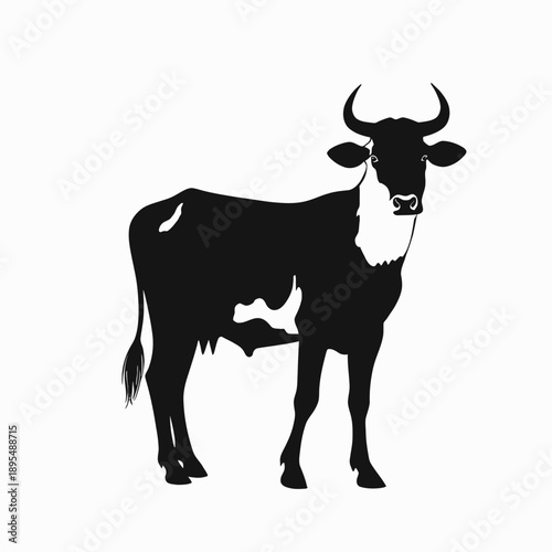 Silhouette of a Majestic Cow Standing Proudly Against a Minimalist White Background Capturing Graceful Contours and Distinctive Horns