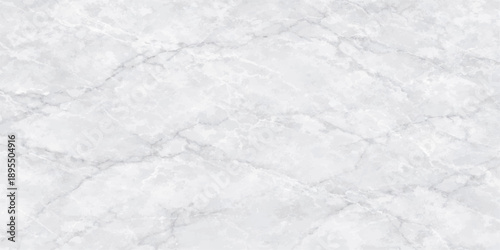 A closeup of white sugar on a white marble texture creates an abstract frozen surface of snowy frost and winter crystals under a cold blue sky