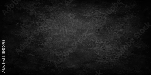 A dark and moody vintage backdrop featuring a rough, scratched concrete wall texture with a dirty black and gray grunge surface for an old industrial design