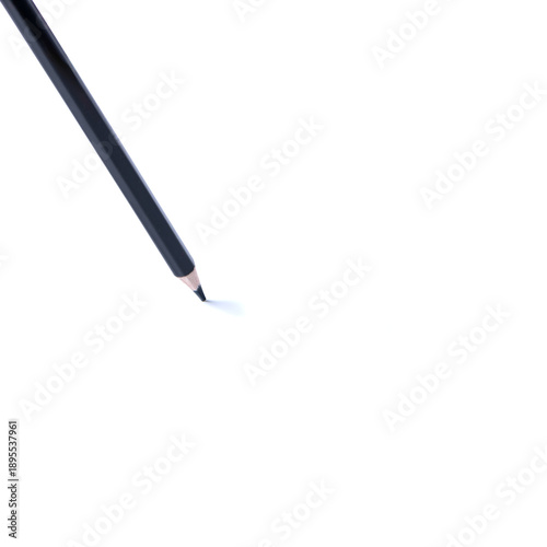 Single black wooden pencil with sharpened tip isolated on white background, minimal composition with copy space. Concept of creativity, writing, drawing, and education.