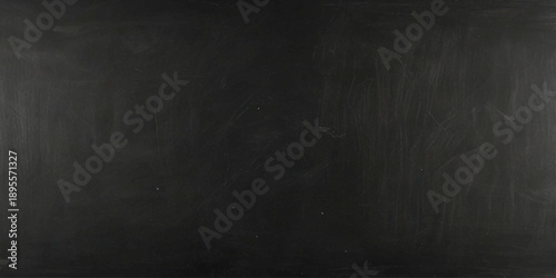Matte black chalkboard surface with soft shadows and empty educational background