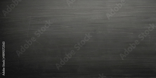 Dark gray chalkboard texture background with soft erased marks and matte classroom surface