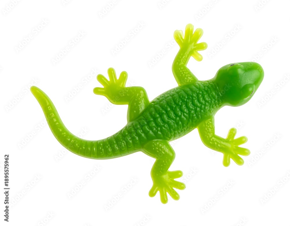 Fototapeta premium Overhead view of a bright green plastic toy lizard against a plain white backdrop