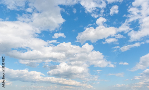 Beautiful sky, white fluffy clouds, multi-layered and varied, sun and blue sky. Majestic view in summer.