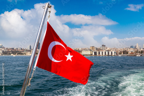 Turkish flag is waving against Istanbul