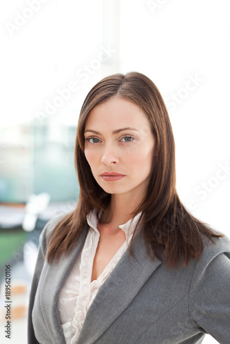 Free Download Female posing, facing camera in office with backlit window, wearing gray blazer and ruffled blouse - GFXLoad