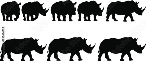 Black rhinoceros silhouette collection showing walking and standing rhino poses in vector style for wildlife design, conservation themes, logos, prints, and branding