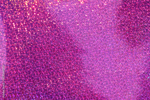 Pink and purple glitter texture with shimmering light reflections