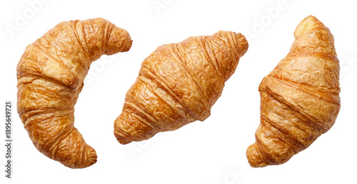 Konstfotografi three golden brown croissants arranged in a curved line against a transparent background, showcasing their flaky texture and delicious appeal
