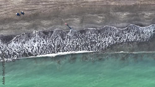 Aerial View of Black Sand Beach Hac Sa with Waves and Beachgoers in Coloane Macau