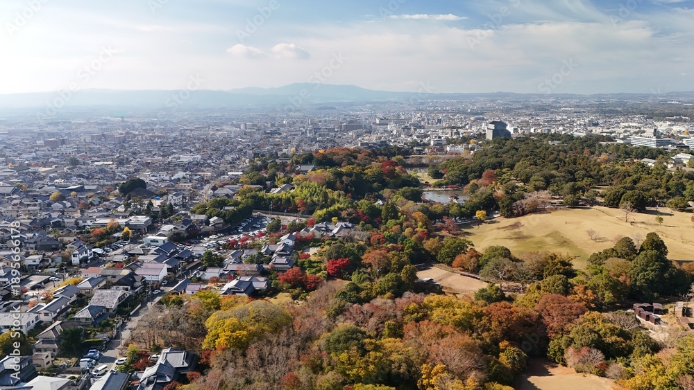 Obraz premium Nara, Japan: Aerial Footage of Nara Park in Autumn, Tōdai-ji Temple Roofline, Cityscape in Distance, Mount Wakakusa, Kasuga Primeval Forest, Scenic Nature and Cultural Heritage
