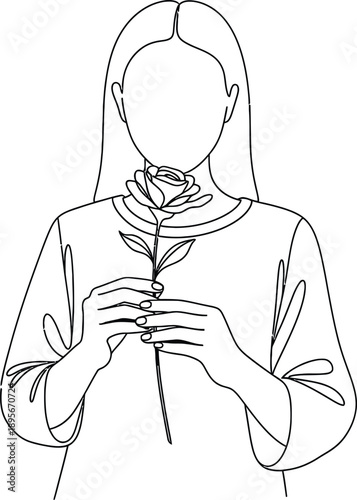 Woman holding a rose in her hands