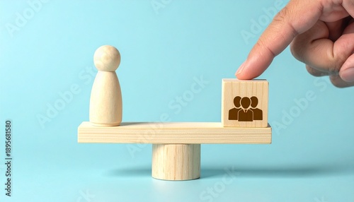 Hand tipping scale between individual and group