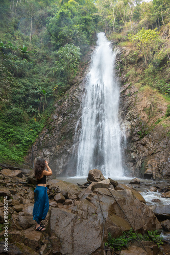 Canvas-taulu Tourist looking to beautiful view of Khun Korn waterfall an iconic natural attraction place and tallest waterfalls (70 metres) in Chiang Rai province of Thailand