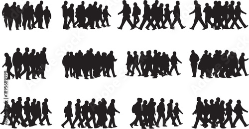 Silhouettes of people walking in groups together outdoors