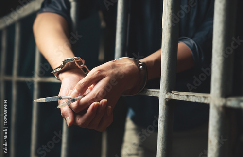 Wallpaper Mural Handcuffs on wrist, drug syringe Torontodigital.ca