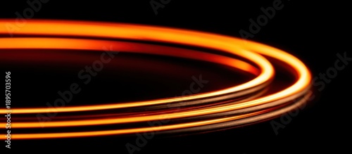 Glowing orange light trails on black background.
