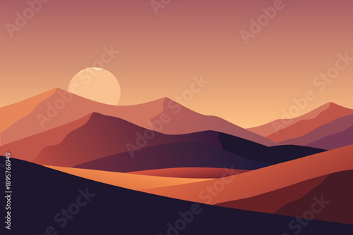 Sunset over mountain landscape with orange sky and silhouetted hills