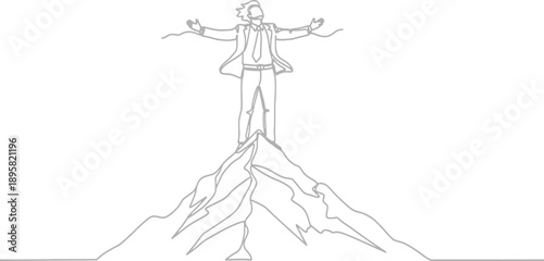 Man standing on top of mountain with arms outstretched