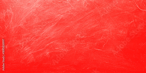 Red fabric texture with a grunge paint design creates a rough vintage wallpaper surface, blending pink and red tones into an old material backdrop