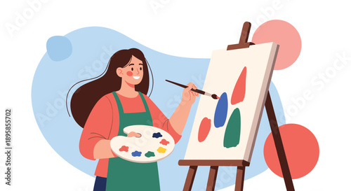 A happy young woman wearing an apron is painting a colorful abstract artwork on a canvas using a brush and a color palette.