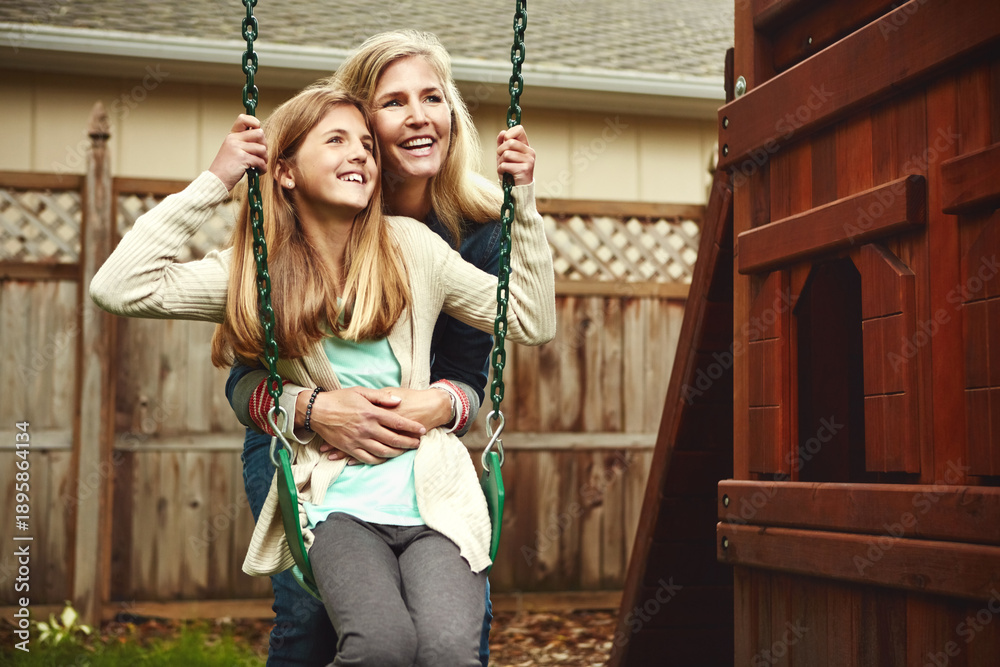 Obraz premium Swing, mother and girl in backyard, game and thinking with smile, weekend break and funny. Outdoor, woman and mama with daughter, happiness and bonding together with humor, contemplation and wonder