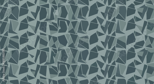 Monochromatic geometric abstract pattern with fragmented shapes and angular elements in shades of blue-grey.