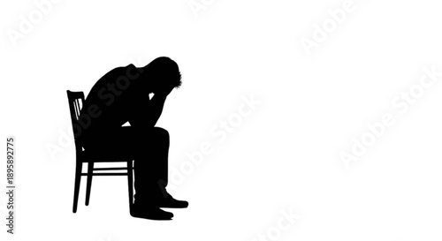 Person sitting with head down