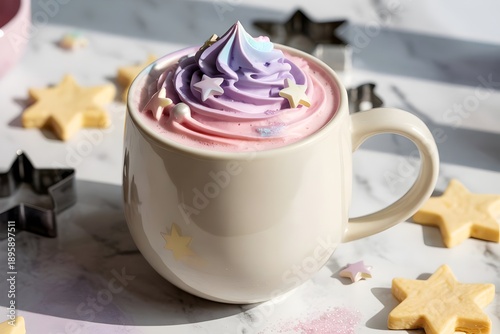 Pink rainbow whipped cream coffee with silver star sprinkles in white cup on marble table unicorn latte hot chocolate concept