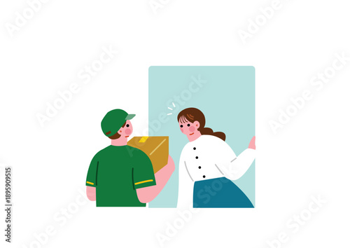 配達員から荷物を受け取る女性