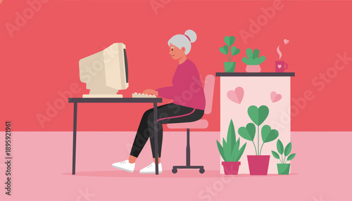 Happy senior woman working on a vintage desktop computer learning technology in her cozy home office