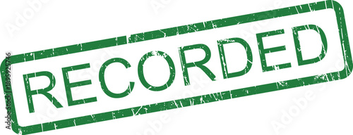 A textured green rubber stamp with a grunge effect boldly features the word RECORDED on a white surface