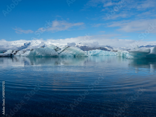 Icebergs floating in pristine blue waters of Iceland's Jokulsarlon Glacier Lagoon