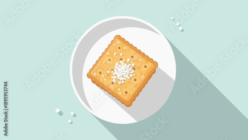 Square cracker with salt on white plate with long shadow