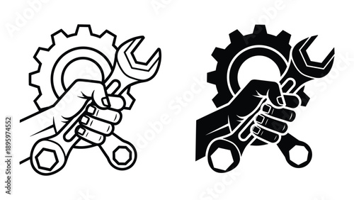 Hand holding wrench and spanner with gearwheel in background