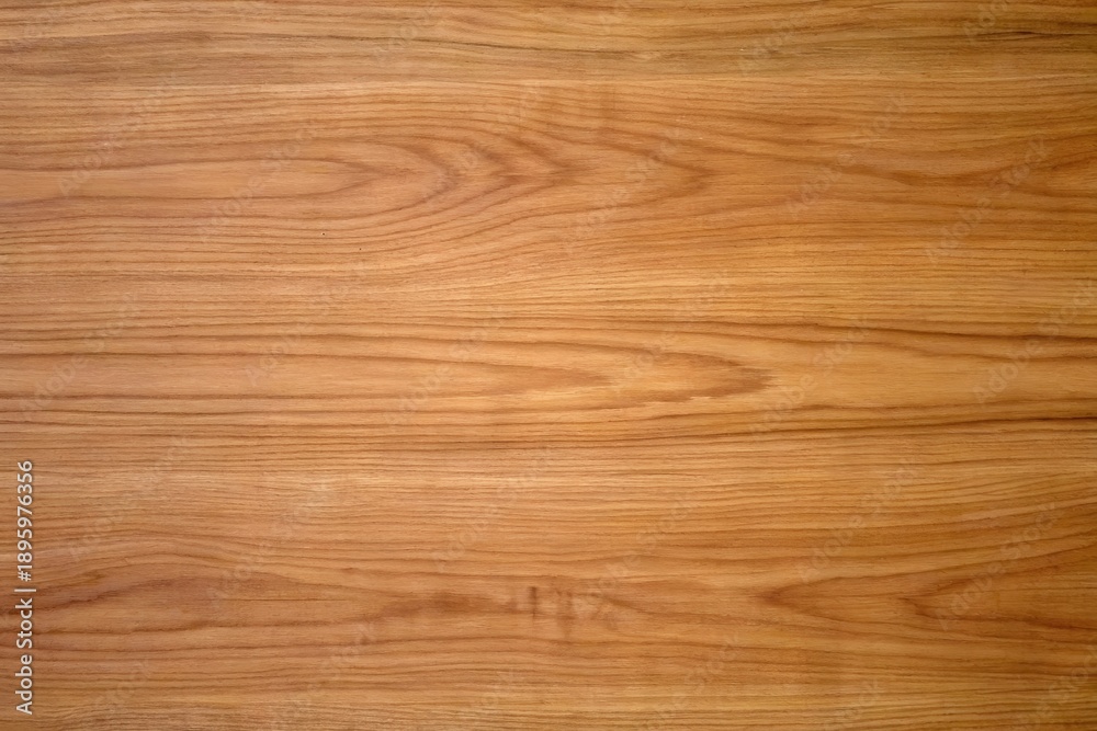 Fototapeta premium natural warm medium golden brown oak wood plank texture with prominent horizontal wavy grain lines subtle small dark knots fine natural variations smooth polished surface background for rustic luxury 