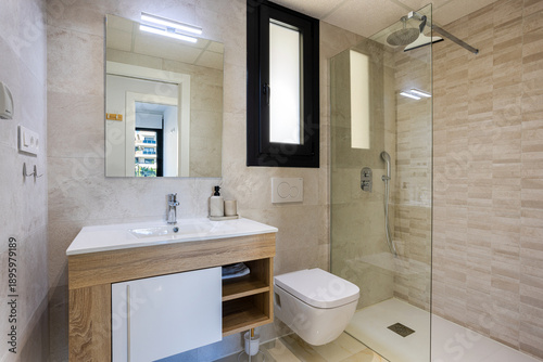 Modern minimalist apartment bathroom with glass walk-in shower and wood floating vanity