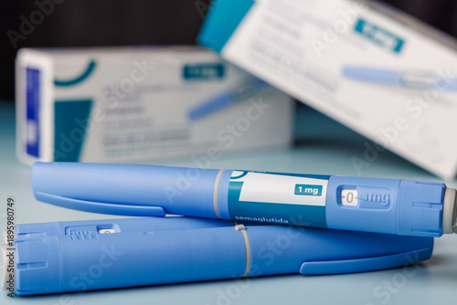Pharma semaglutide GLP-1 injector pens with boxes on a blue gradient background for metabolic health and weight loss therapy concepts.