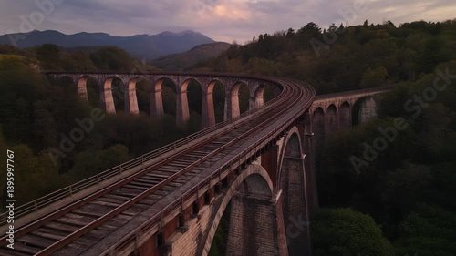 Wallpaper Mural Spectacular aerial view of a railway viaduct blending seamlessly into lush natural landscape Torontodigital.ca