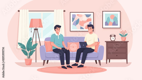 Two men conversing on a sofa with a laptop