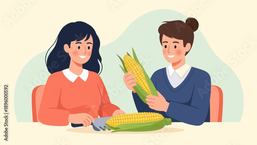 Two happy people prepare corn on the cob for a meal