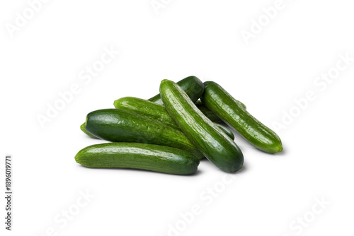 Fresh green mini cucumbers piling on transparent background