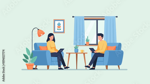 Two people sit in armchairs using laptops near a window