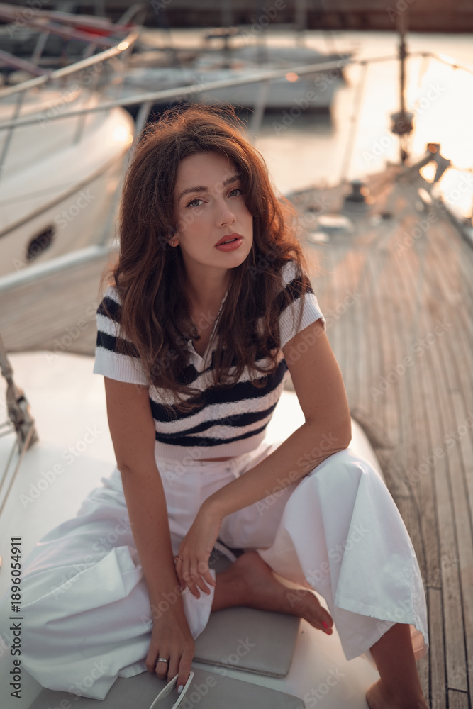Obraz premium Moonlit Marina Portrait Of A Woman On Boat