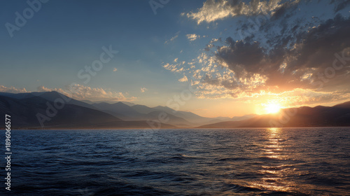 Sunrise Over Mountain Range and Water